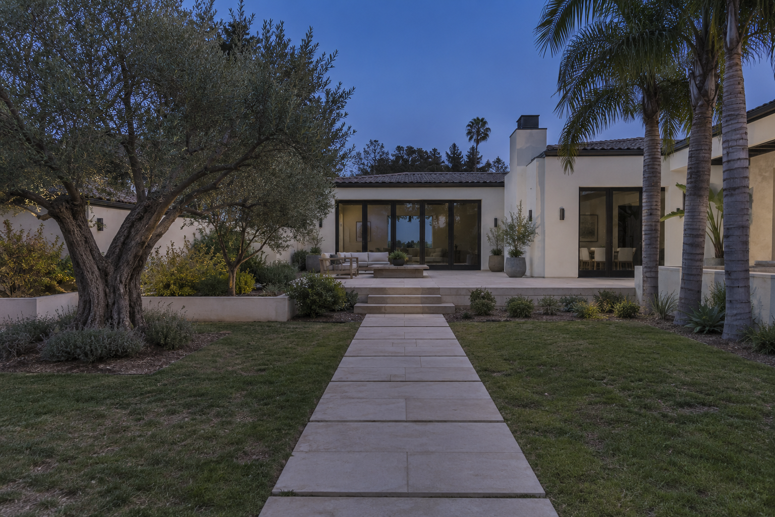 Before concept: a yard at dusk without landscape lighting.
